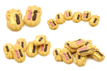 freshly baked decorated cookies with chocolate dressing on a white background