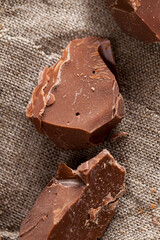 broken into several parts pieces of chocolate from cocoa