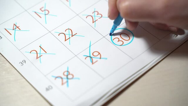 Calendar Mark Off Days Go By Time - day of the month card - start and finish a journey in stages until the goal is reached. Girl marks dates with marker. Circle last day of the mount
