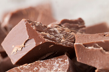 pieces of bitter chocolate are randomly scattered on the table