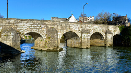 Fototapeta na wymiar Old bridge on the river Sarthe at Alençon of the Lower Normandy region in France