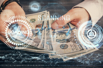 Multi exposure of technology drawing hologram and us dollars bills and man hands. Data concept