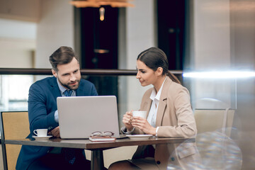 Fototapeta premium Business partners sitting at the table and discussing the project