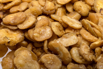 Roasted and salted fava beans for a healthy vegan and vegetarian diet snack. High in protein,...