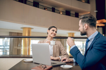 Partners sitting at the table and looking involved