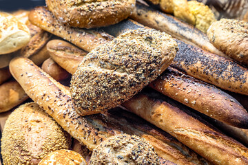 many different types of bread. Wholegrain, round, rolls and loaves