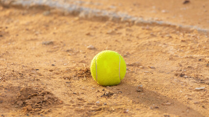 Losted tennis ball at sand