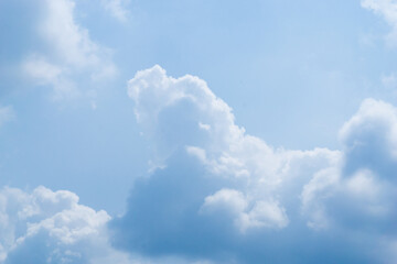 Beautiful view of blue sky with clouds. Beautiful shapes, partly cloudy. Colorful sunset. Natural sky background texture, beautiful color. Bright landscape in the blue sky.