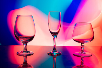 glass glasses on a multicolored background