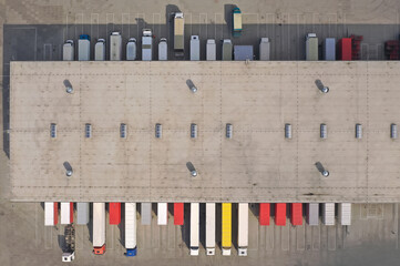 Aerial view of goods warehouse. Logistics center in industrial city zone from above. Aerial view of...