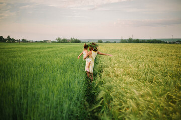 mom and daughter in the field. summertime.