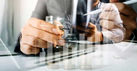 Businesswomen hands working with finances about cost and calculator and laptop with tablet, smartphone at office in morning light