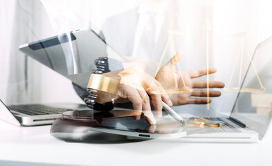 Business and lawyers discussing contract papers with brass scale on desk in office. Law, legal services, advice, justice and law concept picture with film grain effect