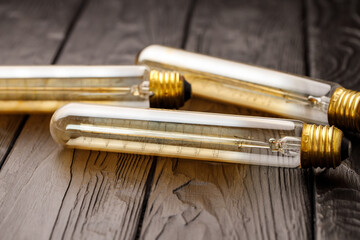 Light bulbs on dark wooden background close up