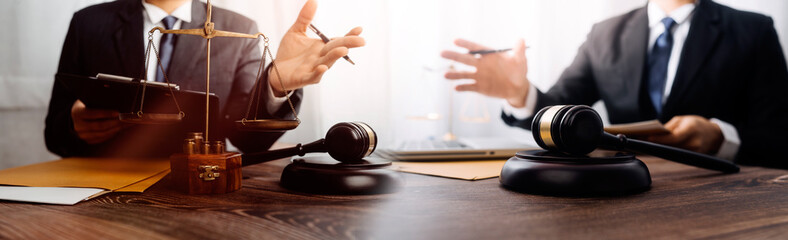 Business and lawyers discussing contract papers with brass scale on desk in office. Law, legal...