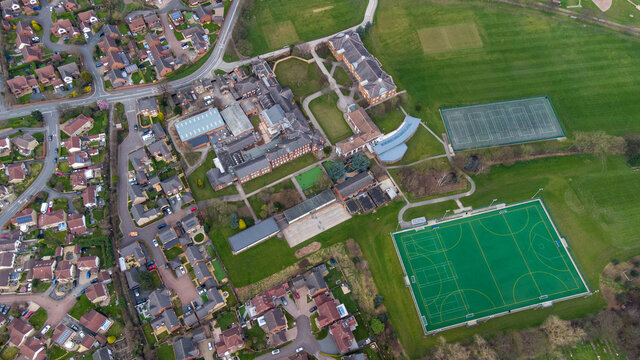 Straight down aerial drone photo of a Schools football pitches and playing field in the British town of town of Alverthorpe in Wakefield in the UK in the Spring time