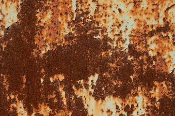Textured grunge background ferruginous red peeling paint with rust on old metal surface