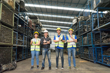 Man and woman work together, diversity of full body of Caucasian and Asian engineer workers stand and give thumbs up  in factory-warehouse