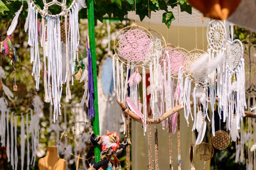 Round dream catchers. Made of wood and tissue. Beautiful ornament, white and pink colours.