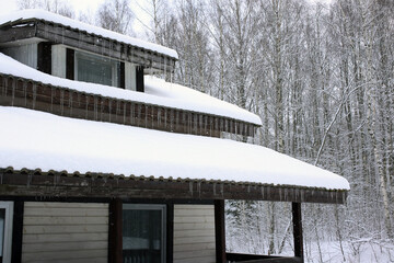 Icicles hanging from the roof of house, horizontal picture