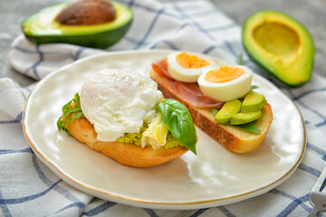 Plate with tasty sandwiches on table
