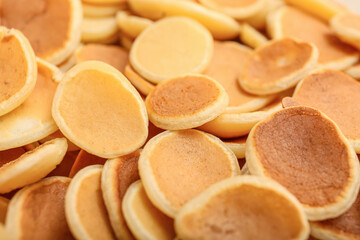 Tasty mini pancakes as background