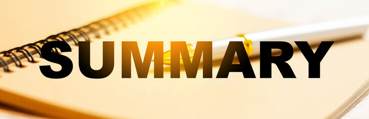 SUMMARY word on the background of a pen and a notebook for composing it at home