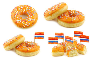 orange donuts with red, white and blue sprinkles and some with a flag toothpick made for dutch...