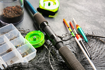 Different fishing equipment on dark background