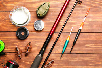 Different fishing equipment on wooden background