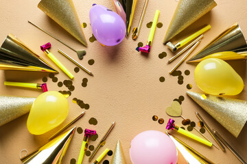 Frame made of party hats on color background