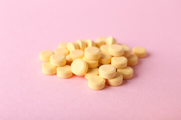Folic acid pills on color background