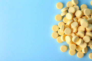 Folic acid pills on color background