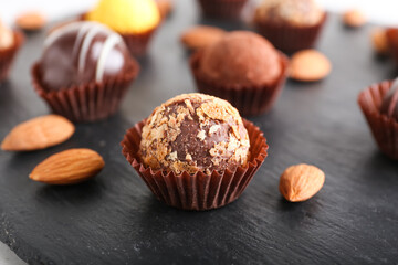 Sweet chocolate candies on dark background