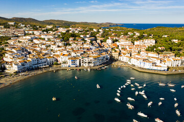 Fototapeta na wymiar View from drone of small town Cadaques and many boats in bay, Costa Brava, Spain, famous tourist destination