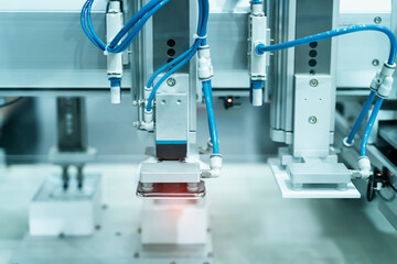 robot with vacuum suckers with conveyor in manufacture phone factory,Smart factory industry 4.0 concept.