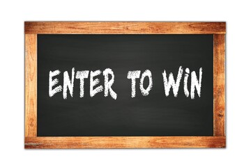 Fototapeta premium ENTER TO WIN text written on wooden frame school blackboard.