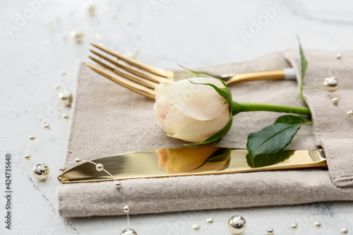 Beautiful table setting for Mother's Day on white background, closeup