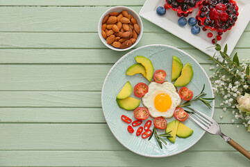 Tasty breakfast on wooden table