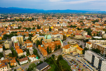 Fototapeta na wymiar View from drone of residential areas of Italian city of Udine in sunny day