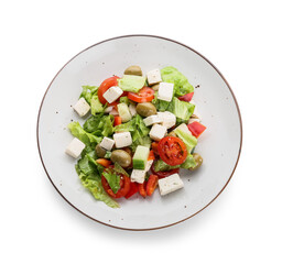 Plate with fresh Greek salad on white background