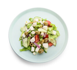 Plate with fresh Greek salad on white background
