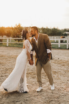 Beautiful wedding couple.  Bohemian wedding  at the ranch. Magic sunset