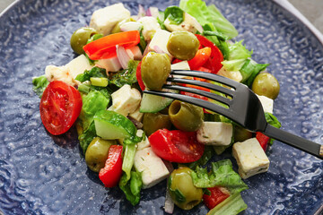 Plate with fresh Greek salad, closeup
