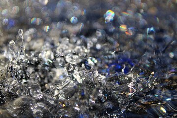 Wallpapers. Frozen movement of water. Drops of water falling and splashing. Sparkles, reflections...