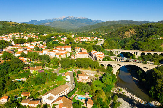 Flight over the city Ceret on summer day. France