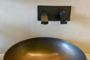 Close up of a sink on a elegant modern bathroom