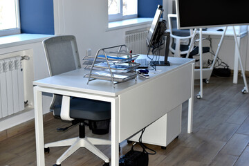 A new workplace in the office with a computer and a white desk