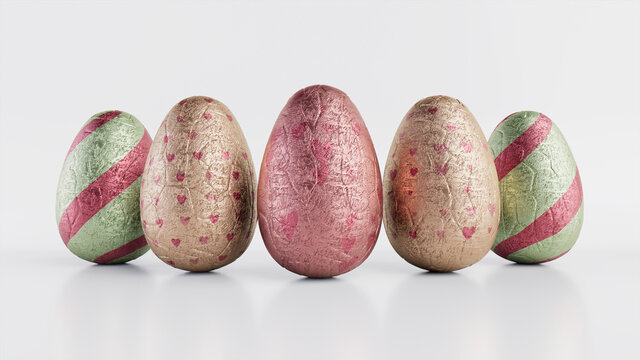 Easter Eggs Isolated Against A White Background. Chocolate Eggs Wrapped In Patterned Pale Green, Rose Gold And Pink Foil. 3D Render