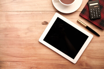 Obraz na płótnie Canvas Flat composition of digital tablet and office stationary on black background 